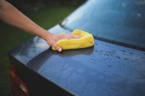 yellow sponge, car wash, black car, washing car